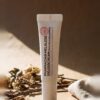 Pharmacian MELALESS 100,000 cream tube on linen with dried botanicals Pharmacian MELALESS 100,000 cream tube on linen with dried botanicals