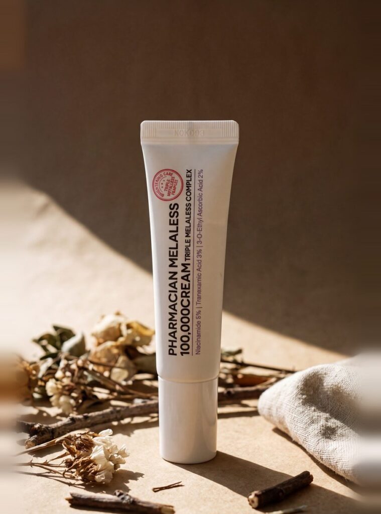 Pharmacian MELALESS 100,000 cream tube on linen with dried botanicals