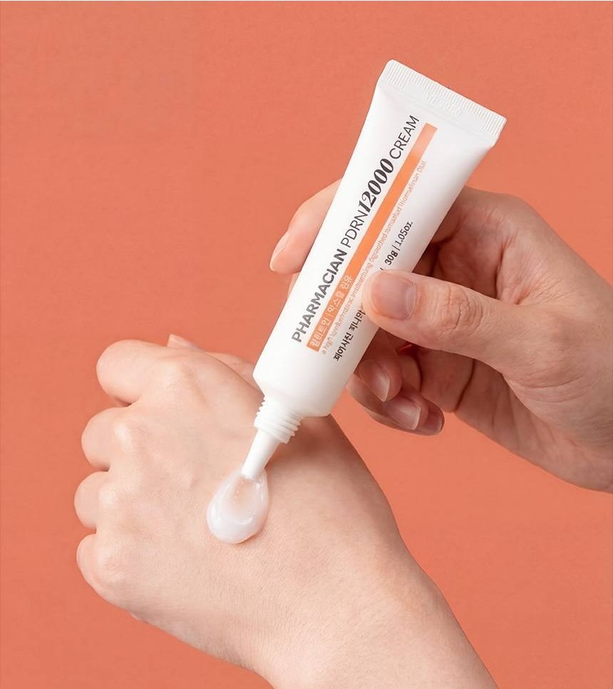 Applying Pharmacian PDRN12000 cream to the back of the hand